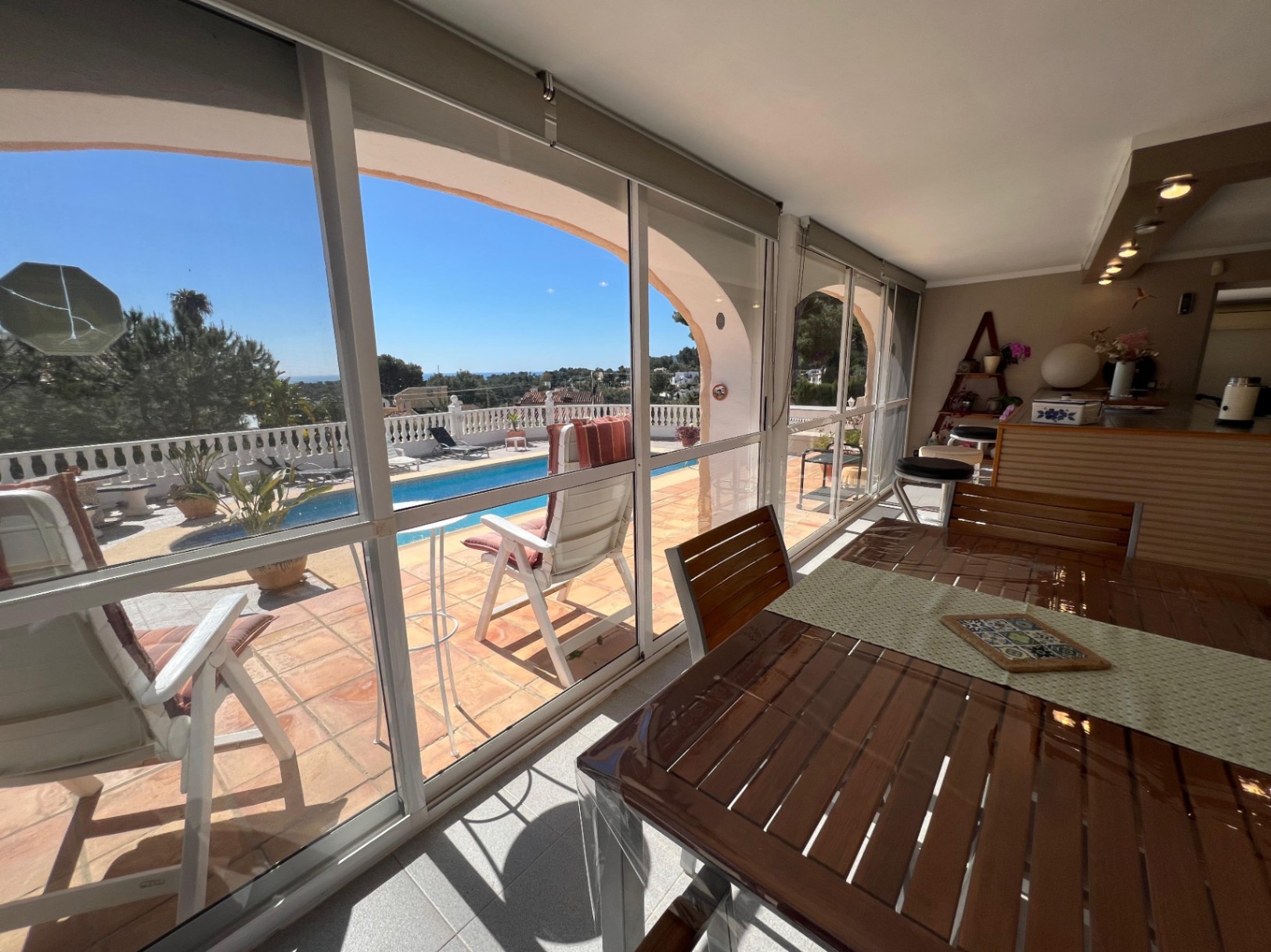 Covered terrace overlooking pool at Mediterranean villa in Benissa