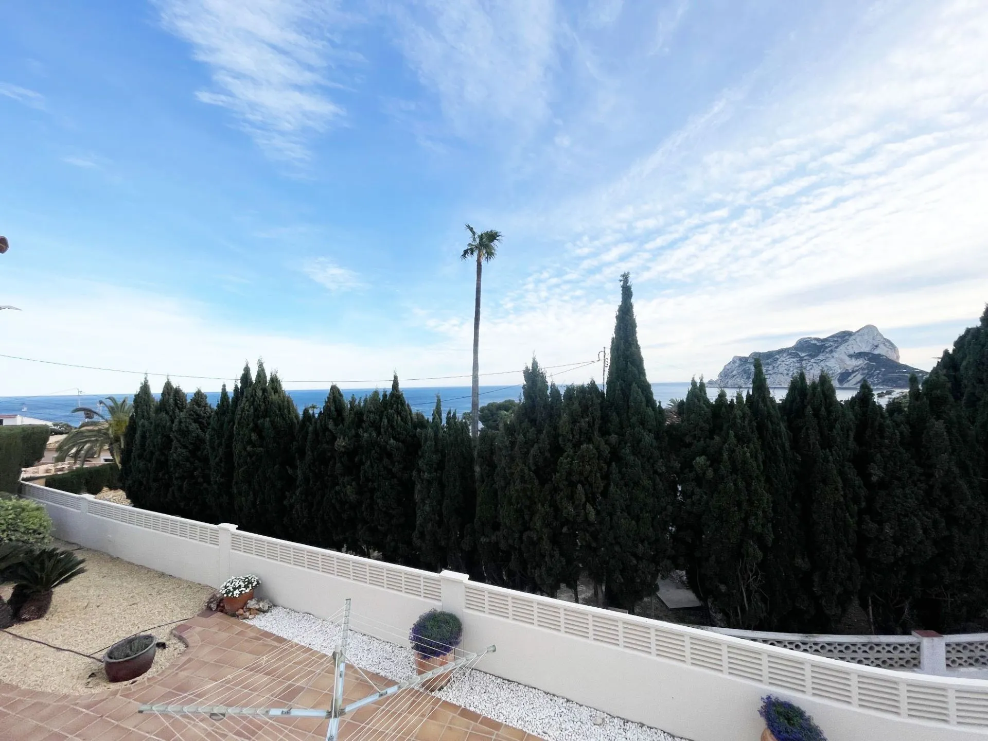 Covered terrace overlooking private pool at renovated villa in Calpe