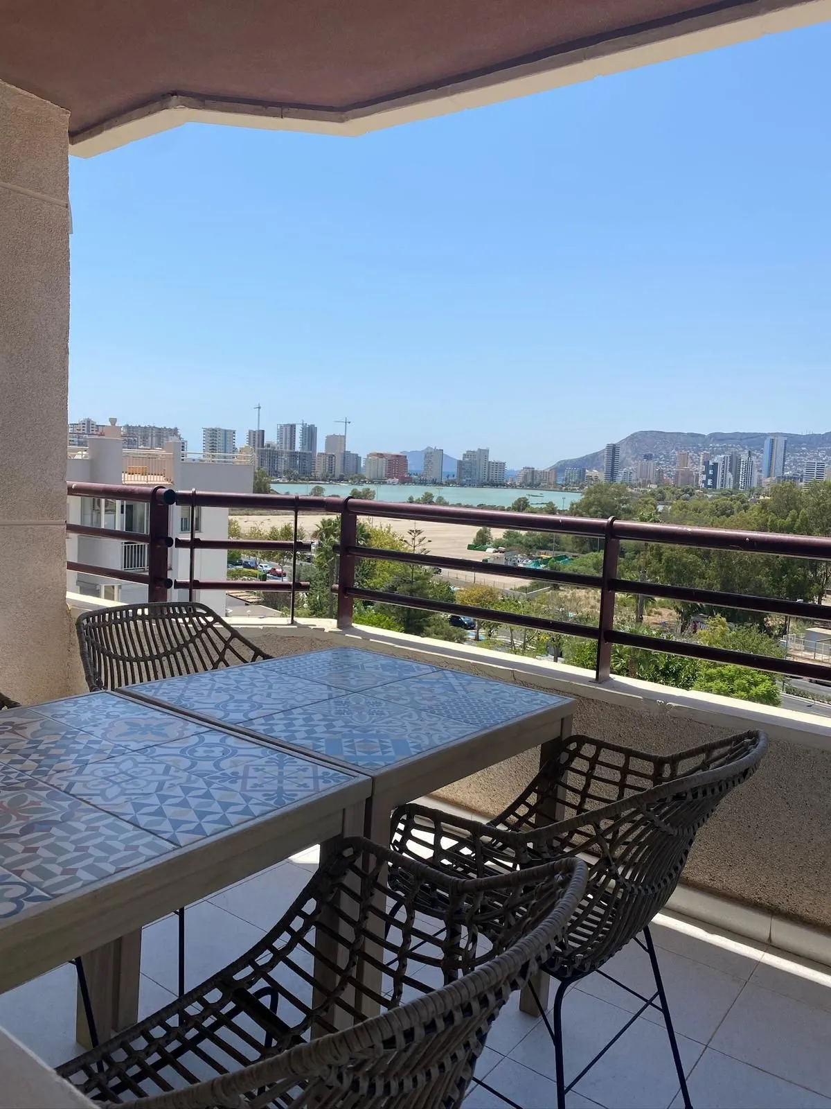 Covered terrace with sea and salt lake views from duplex penthouse in Calpe