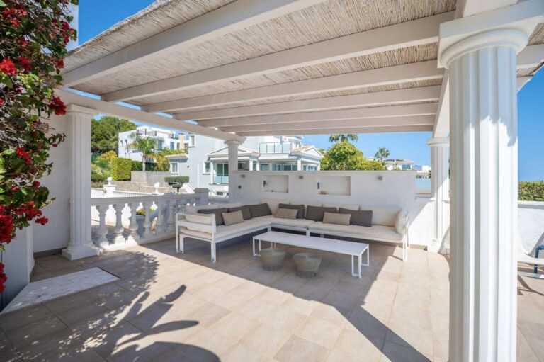 Covered terrace with summer kitchen and outdoor seating area at a villa in Calpe.