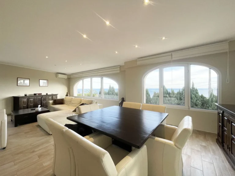 Dining and lounge area with sea views at renovated villa in Calpe