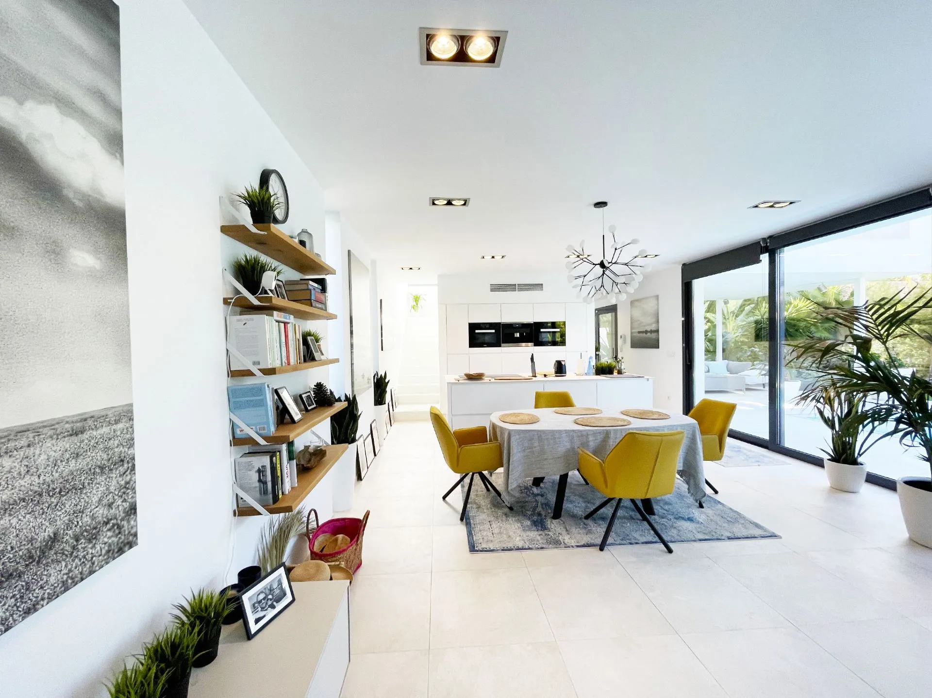 Dining area and open kitchen at modern villa in Calpe