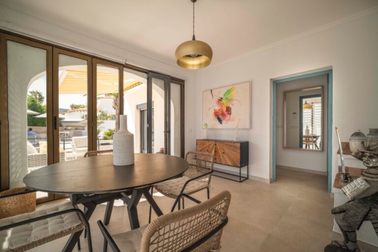 Dining area with terrace access at Ibiza-style villa in Calpe