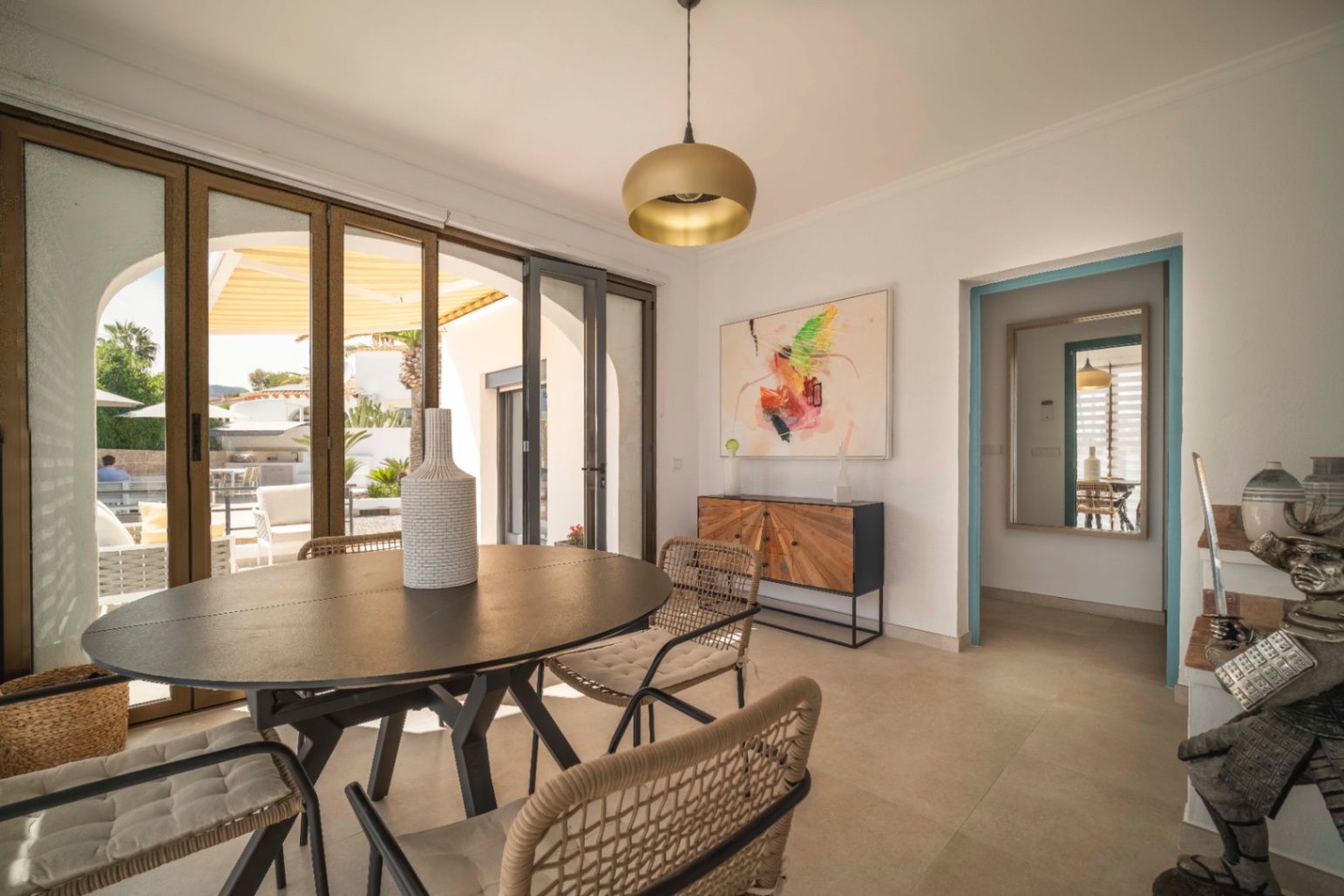 Dining area with terrace access at Ibiza-style villa in Calpe
