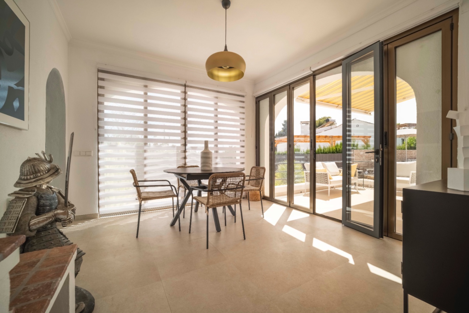 Dining area with terrace access at renovated Ibiza-style villa in Calpe