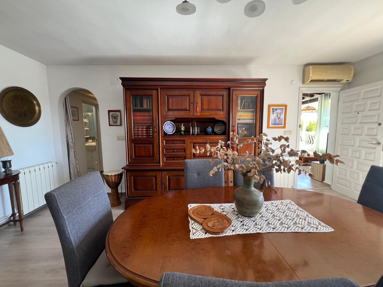 Dining room with wooden furniture at Mediterranean villa in Benissa