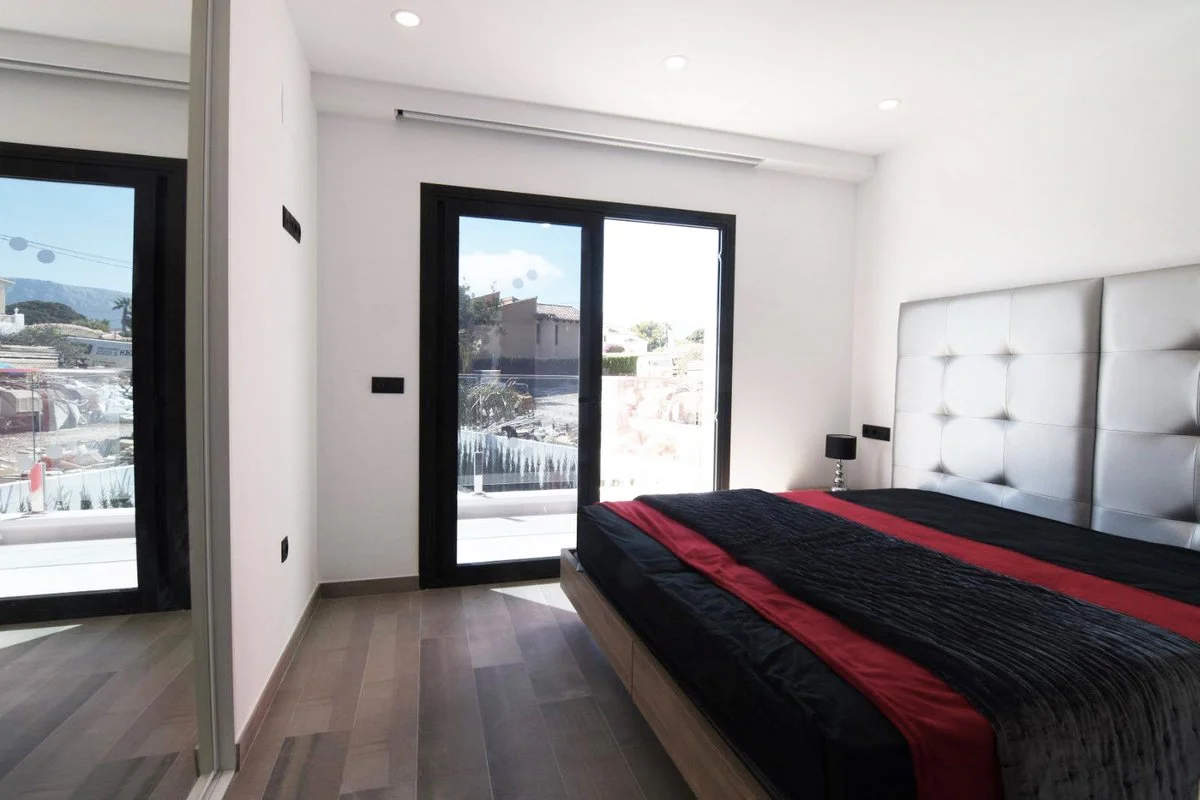 Double bedroom with balcony access in modern villa in Calpe