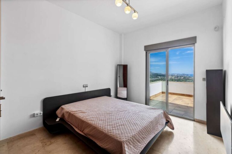 Double bedroom with natural light and open views inside a modern spacious villa in Calpe.
