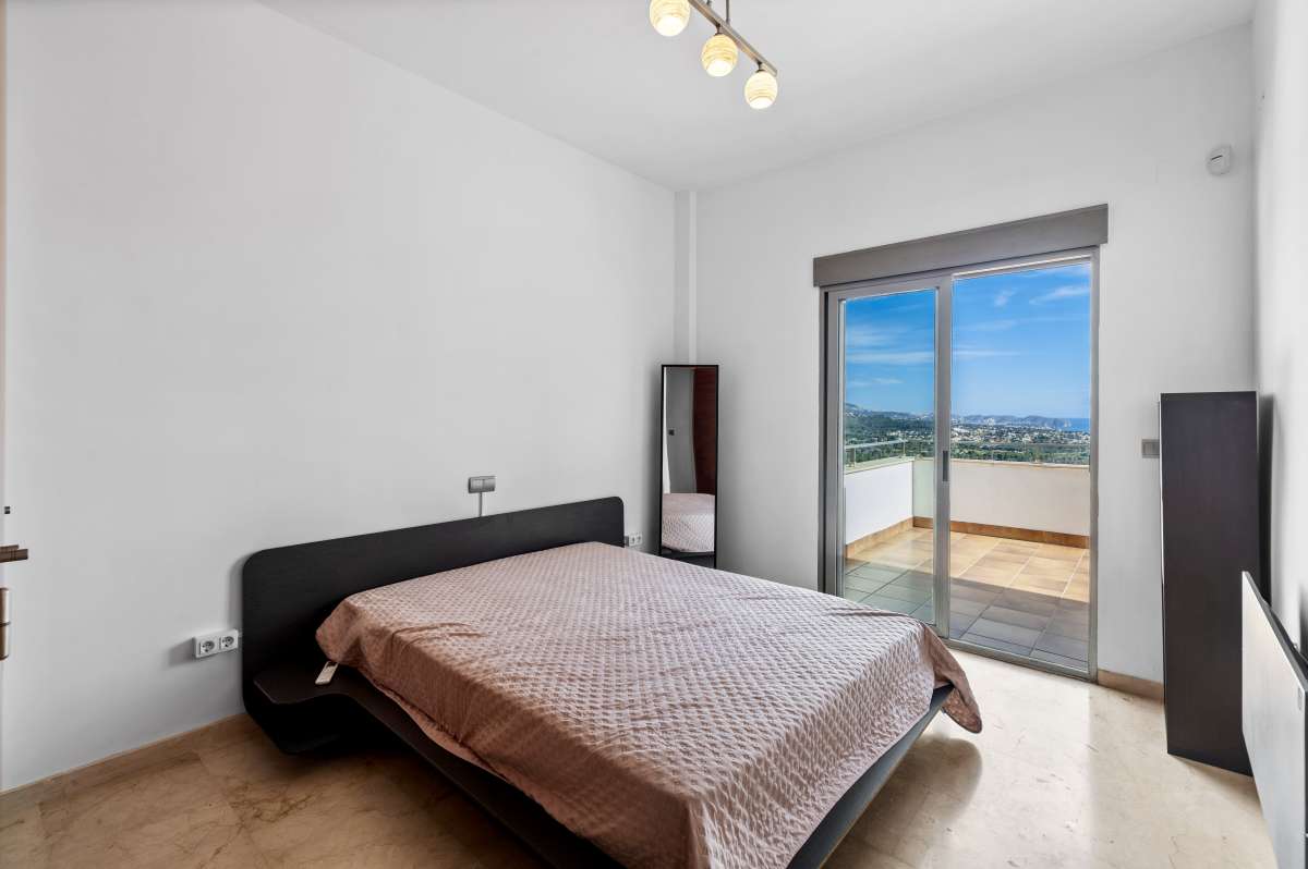 Double bedroom with natural light and open views inside a modern spacious villa in Calpe.
