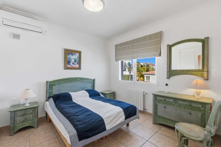 Double bedroom with natural light inside a villa in Calpe.