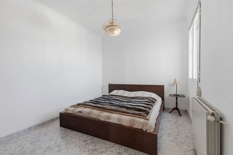 Double bedroom with natural light inside a villa in Calpe.