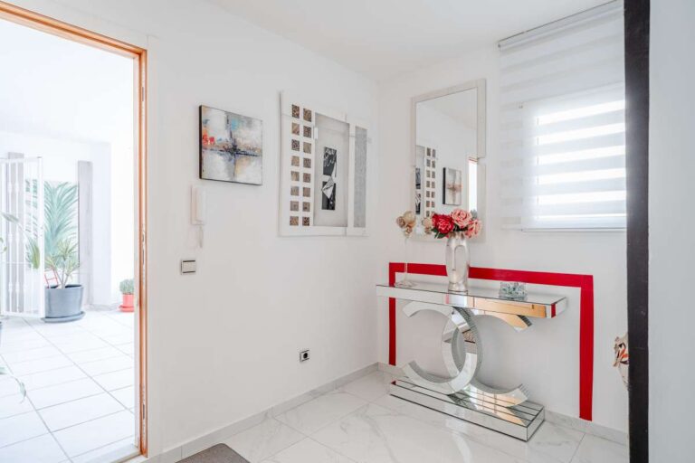 Dressing area inside a renovated apartment in Arenal-Bol, Calpe with modern furniture, bright interior and access to the terrace area