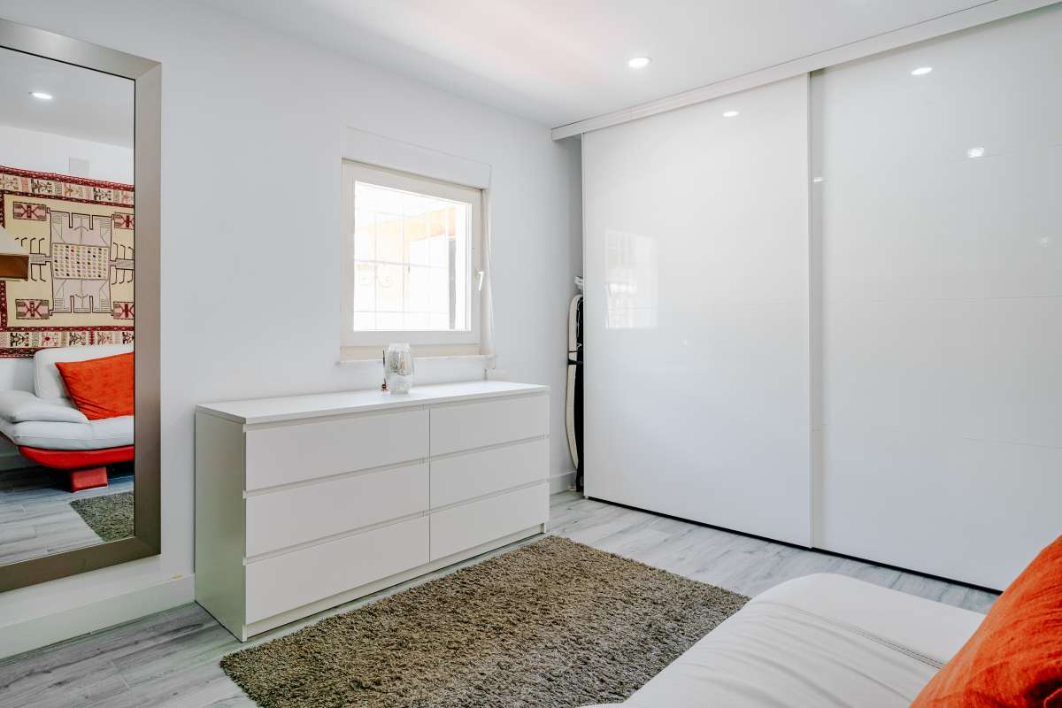 Dressing room with fitted wardrobe and light modern interior inside a renovated Mediterranean villa in La Cometa, Calpe.