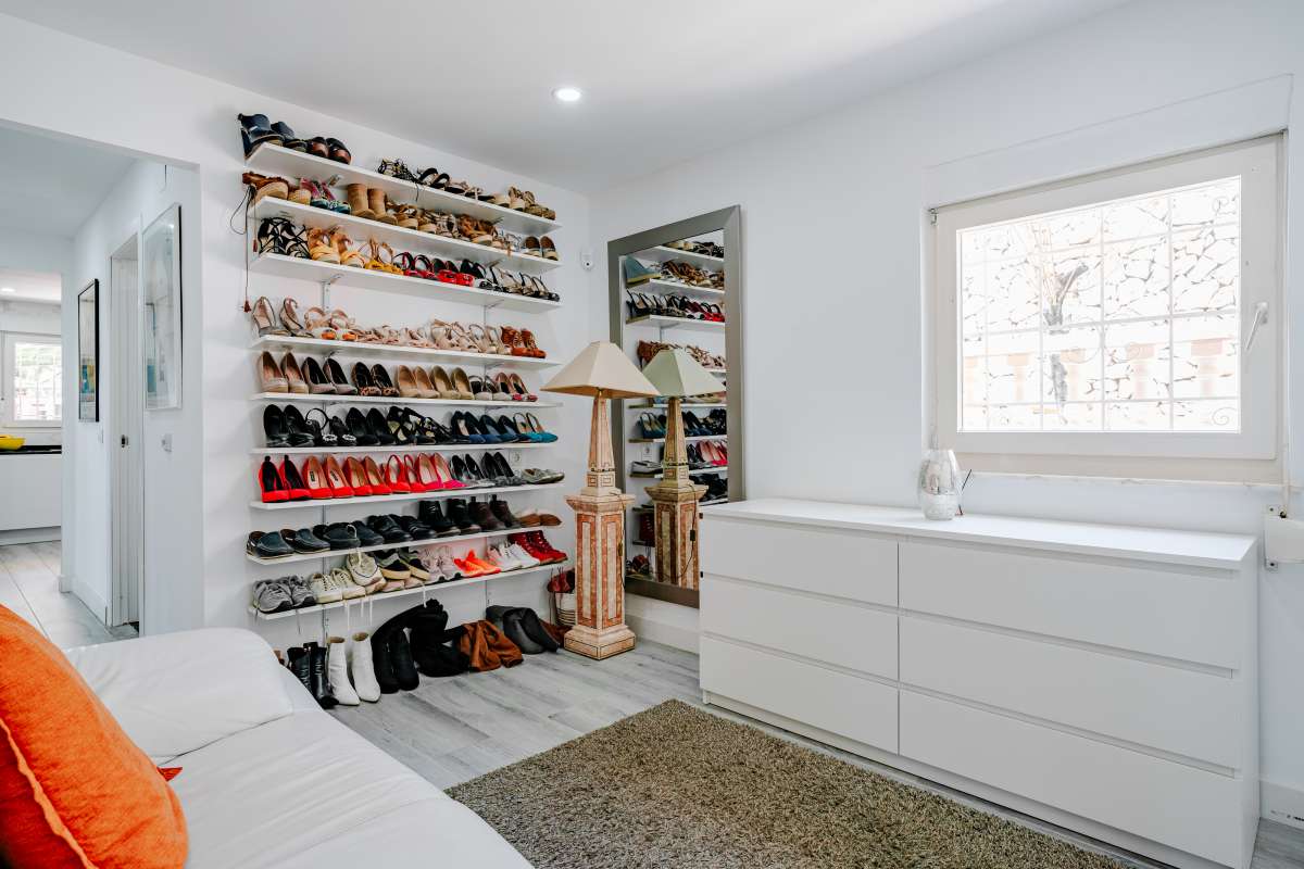 Dressing room with shoe storage, dresser and light modern interior inside a renovated Mediterranean villa in La Cometa, Calpe.
