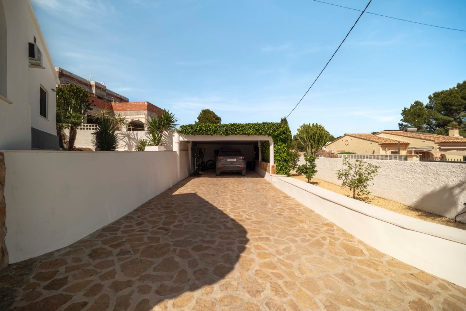 Driveway and garage entrance at renovated villa in Calpe