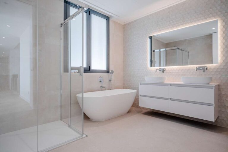 En-suite bathroom inside a modern second-line sea villa in La Calalga, Calpe with freestanding bath, walk-in shower and double vanity