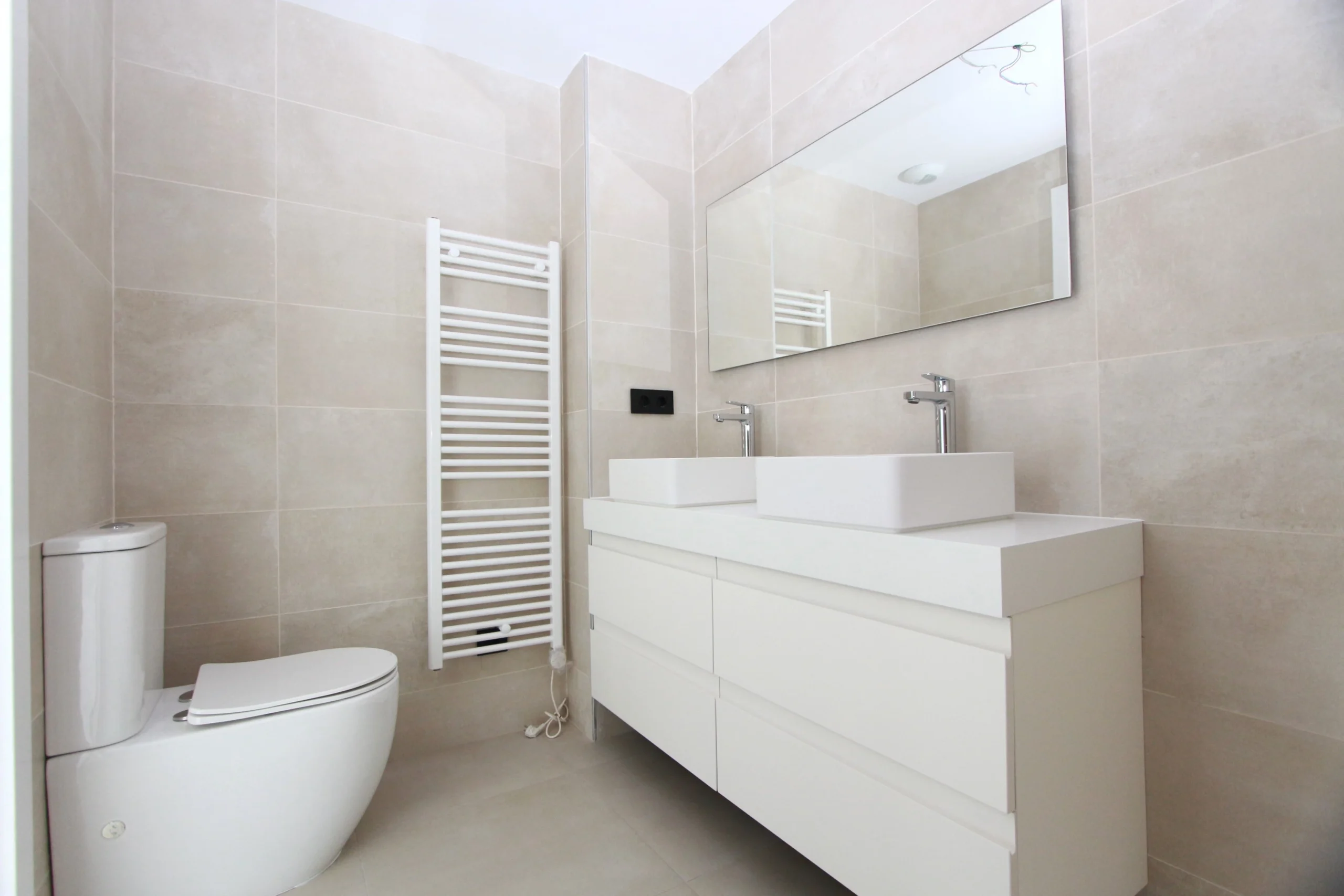 En-suite bathroom with double vanity inside modern luxury penthouse in Calpe