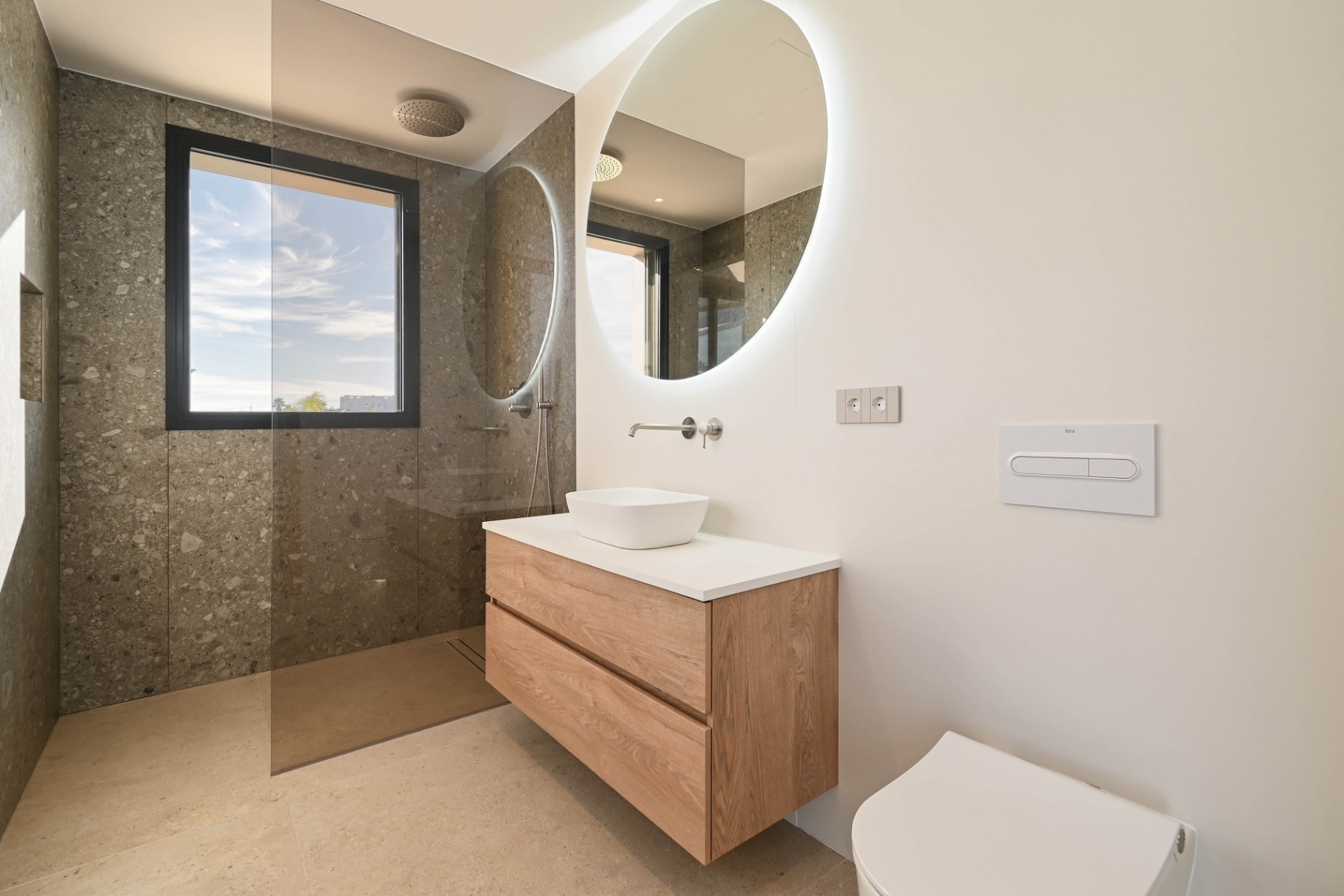 En-suite bathroom with modern vanity at luxury villa near La Fustera Beach