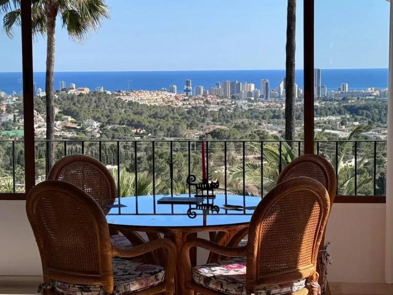 Enclosed terrace lounge with panoramic sea views from a Mediterranean villa in Empedrola, Calpe.