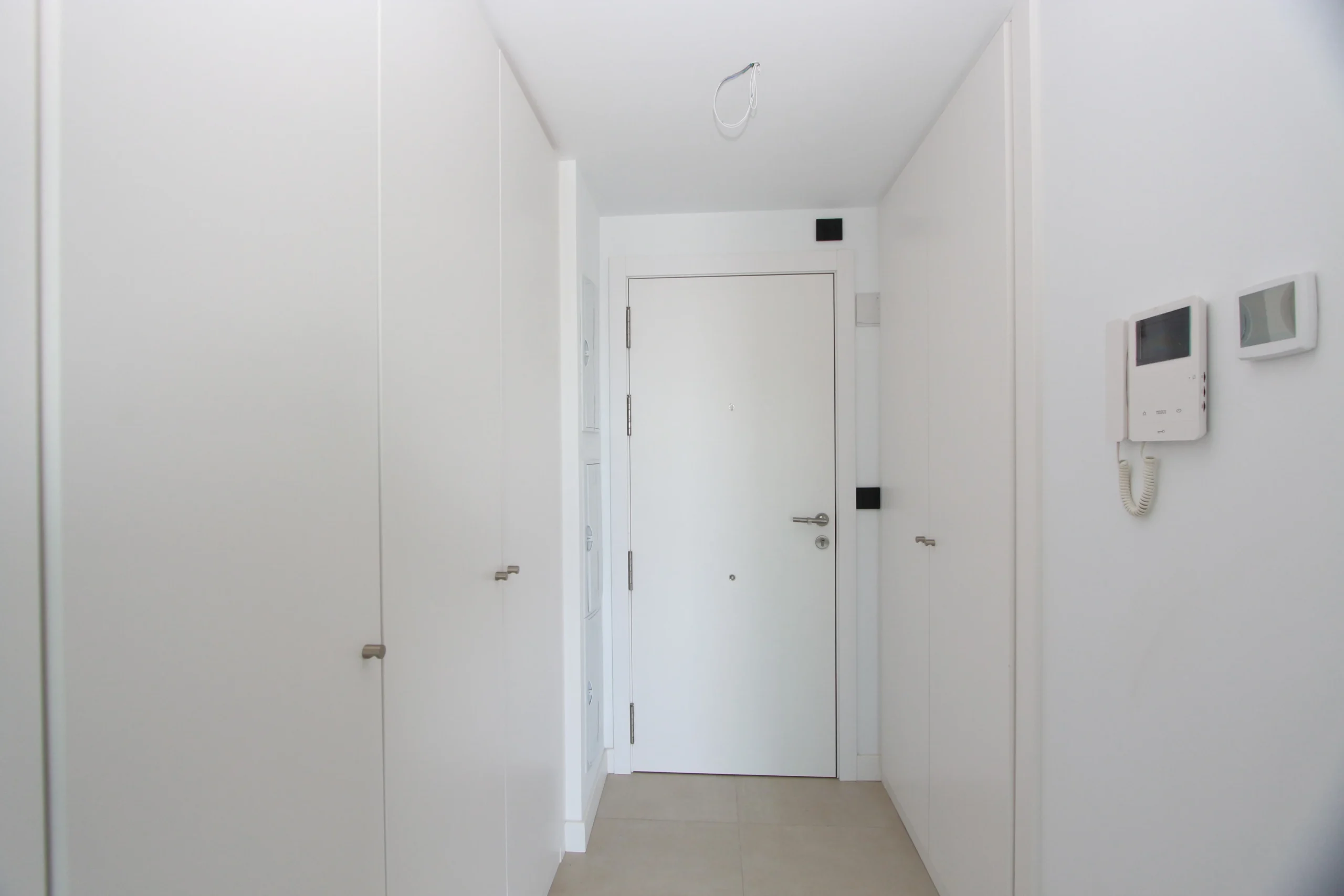 Entrance hallway with built-in storage at modern luxury penthouse in Calpe