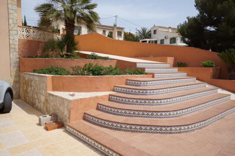 Entrance steps, driveway and exterior wall at a Mediterranean villa in Calpe near La Calalga Beach.