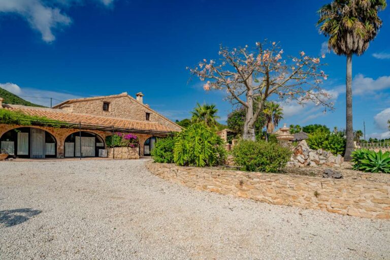 Exterior of a historic finca in Benissa with stone walls, tiled roof, large private grounds and Mediterranean countryside setting