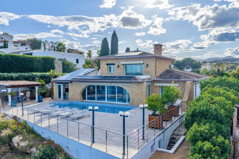 Exterior of a premium coastal villa on the Benissa Costa with private swimming pool, terrace, stone façade and Mediterranean surroundings