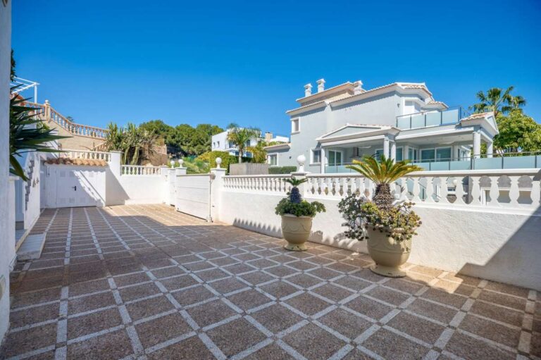 Exterior of a villa in Calpe with spacious terrace areas and sea views.
