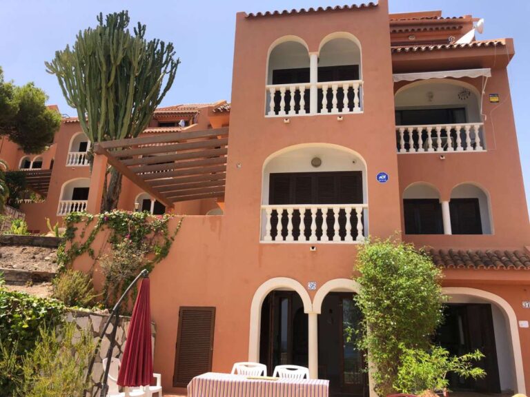 Exterior view of a frontline townhouse in Partida Manzanera, Calpe with private terraces and Mediterranean surroundings
