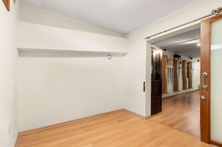 Flexible lower-level room inside a private villa in Calpe with wood flooring and access to independent accommodation