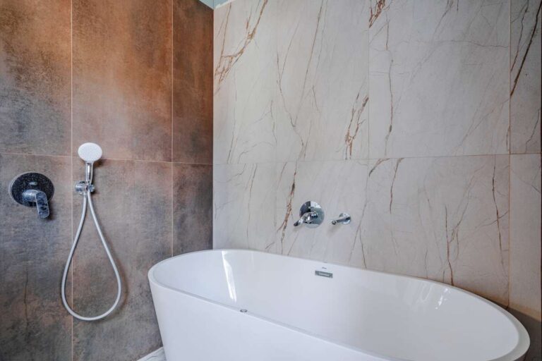 Freestanding bath with modern wall tiles inside a new build villa near the coast in Calpe