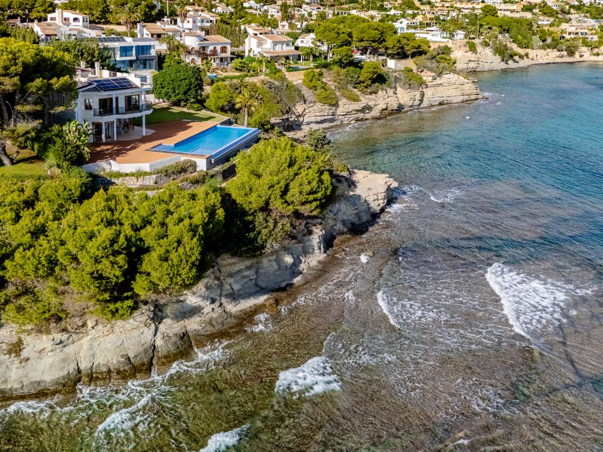 Frontline villa beside the rocky Mediterranean coastline with sea views in Les Bassetes, Benissa Coast.