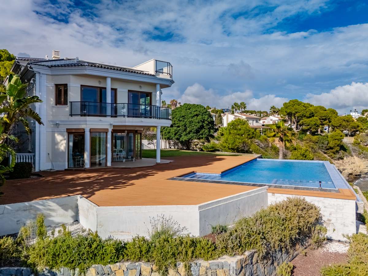 Frontline villa exterior with private pool, large terrace and sea-facing position in Les Bassetes, Benissa Coast.