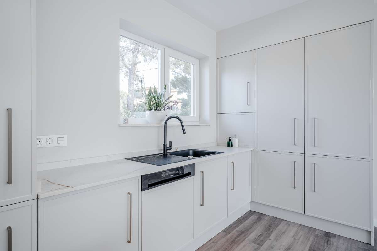 Fully equipped white kitchen with modern appliances inside a new build villa near the coast in Calpe