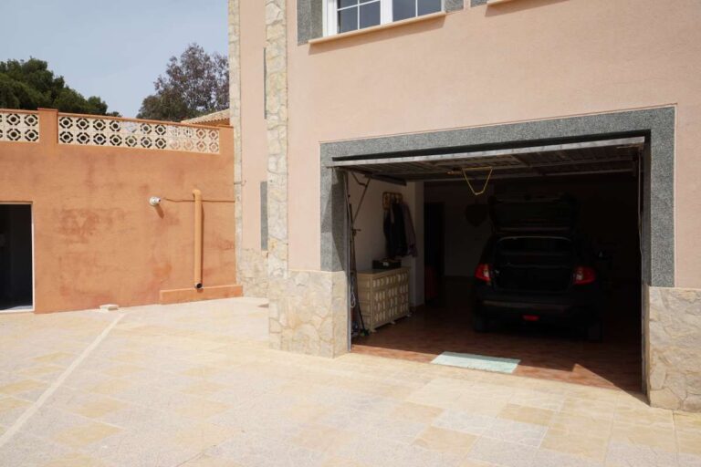 Garage entrance and driveway area at a Mediterranean villa in Calpe within a 10-minute walk of La Calalga Beach.