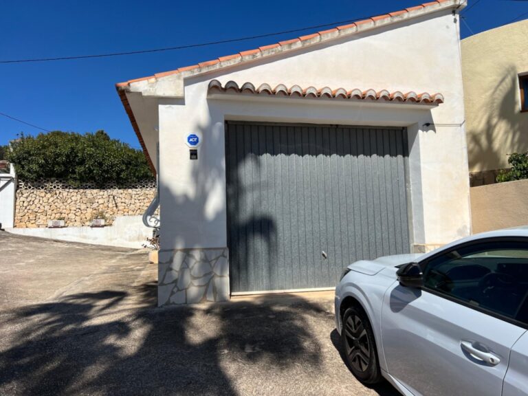 Garage entrance and parking area at Mediterranean villa in Benissa