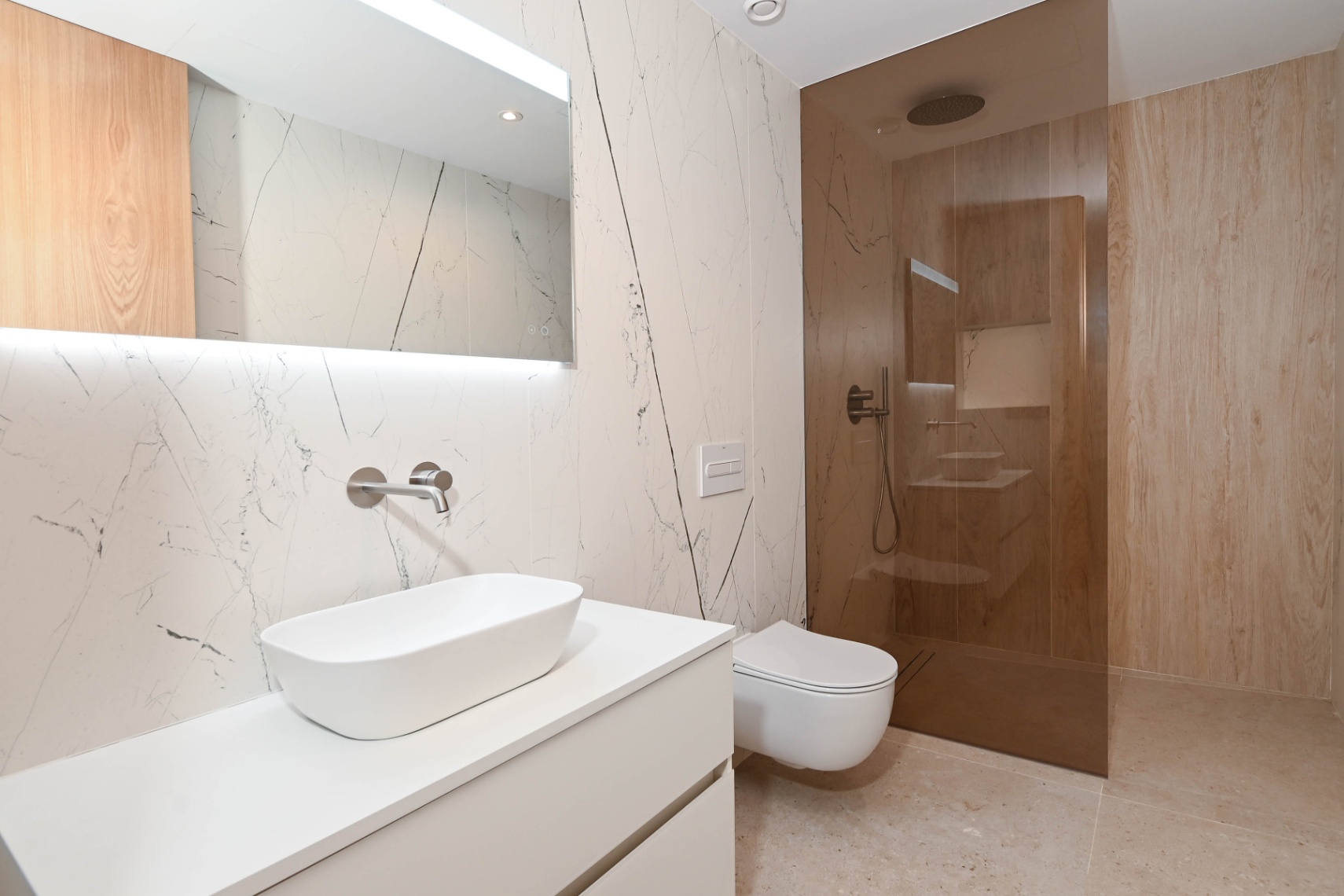 Guest toilet with modern vanity at luxury villa near La Fustera Beach