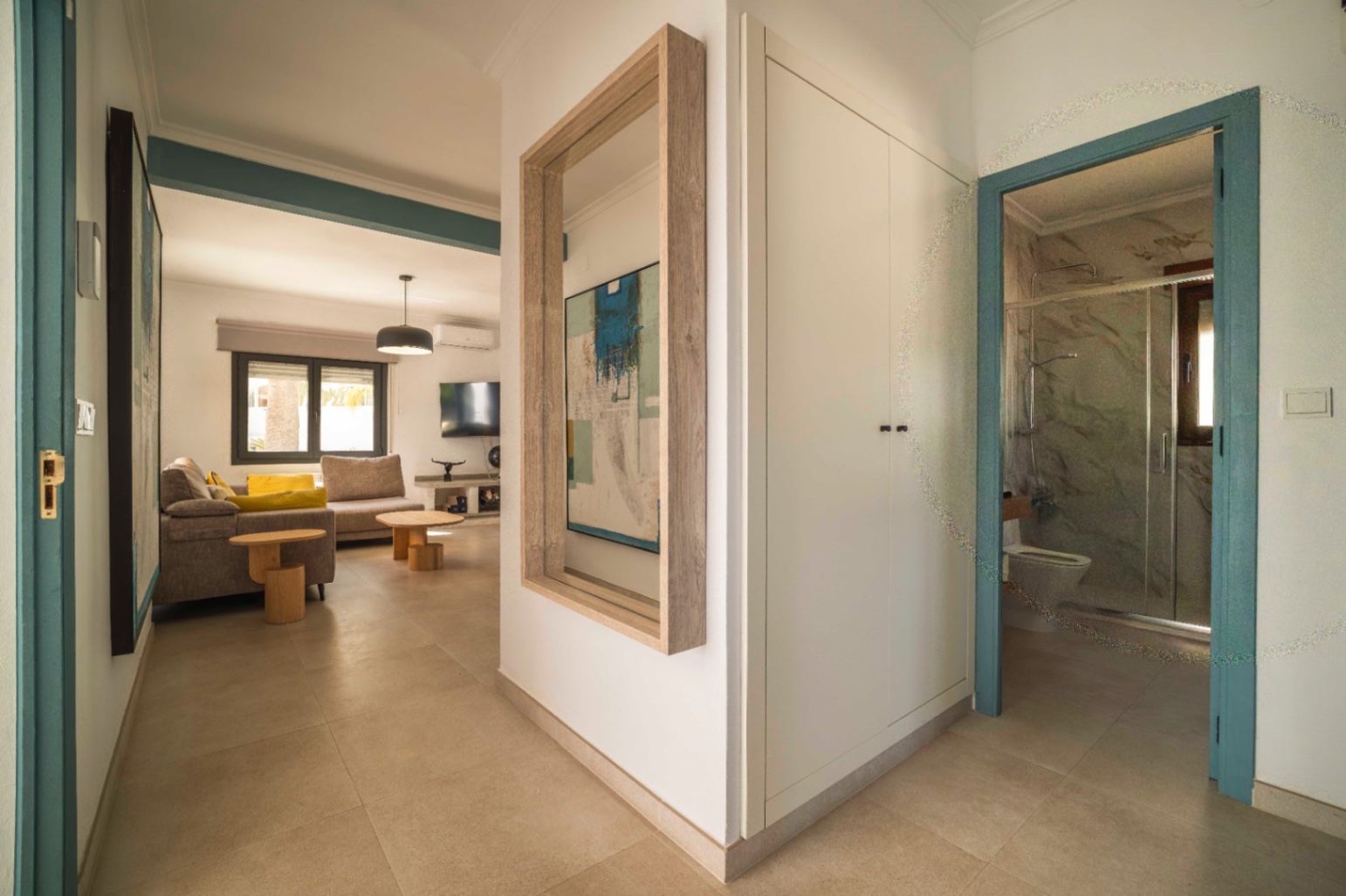 Hallway with turquoise doors inside Ibiza-style villa in Calpe