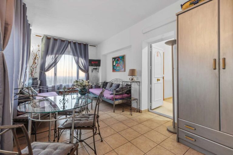 Independent living area inside a panoramic sea view villa in Benissa with dining space, bedroom area and terrace access