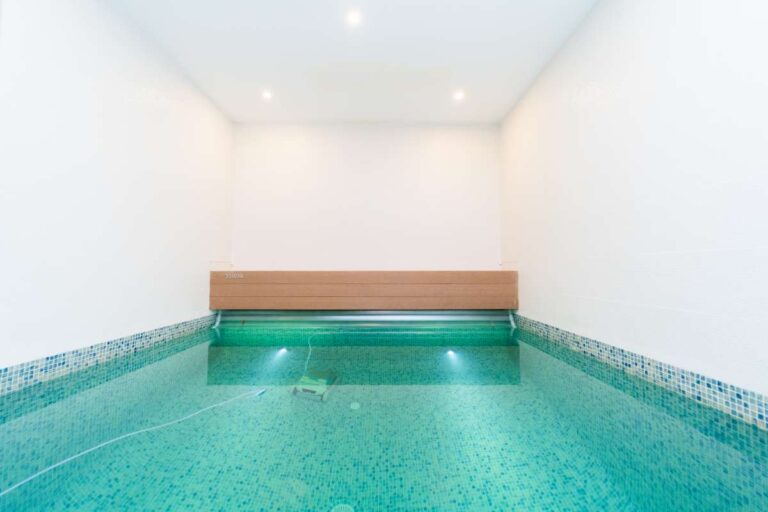 Indoor plunge pool inside a luxury villa in Calpe with tiled finish, integrated lighting and private wellness area