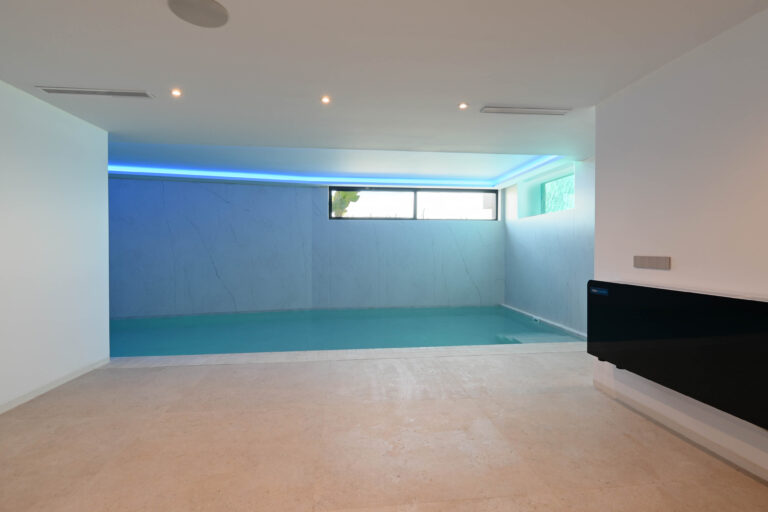 Indoor swimming pool at luxury villa near La Fustera Beach
