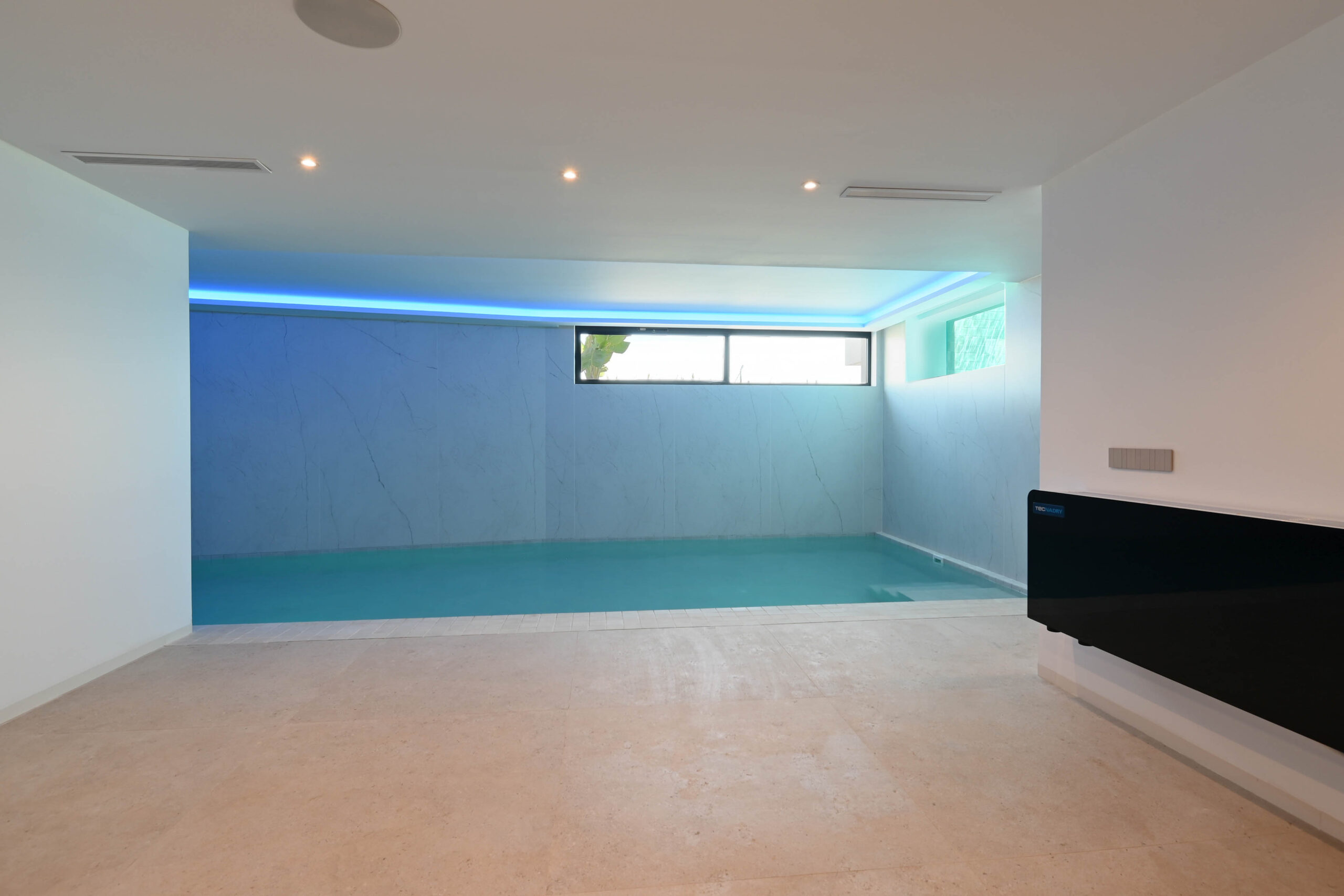 Indoor swimming pool at luxury villa near La Fustera Beach