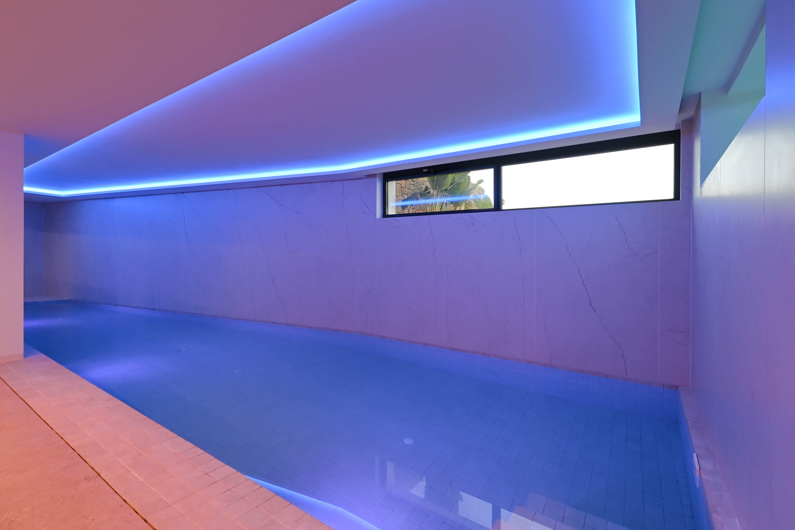 Indoor swimming pool with LED lighting at luxury villa in Benissa