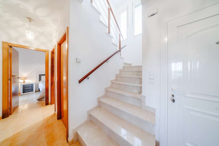 Interior hallway and staircase inside a semi-detached house in Calpe with access to living areas and bedrooms