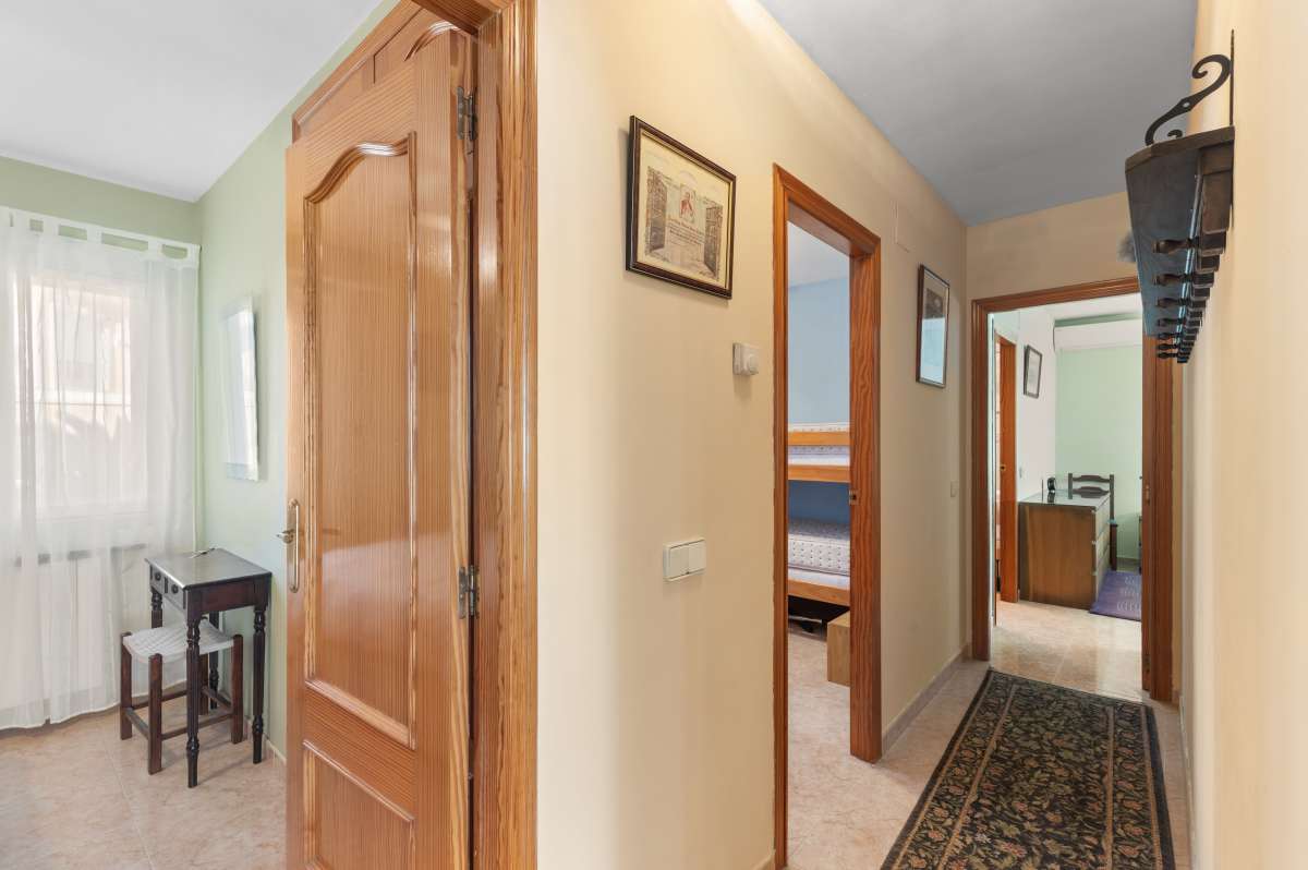 Interior hallway leading to the bedrooms inside a single-level villa in Calpe with a functional layout.