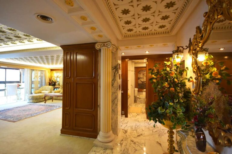 Interior hallway leading to the main living room inside a frontline double penthouse on Arenal Beach in Calpe.