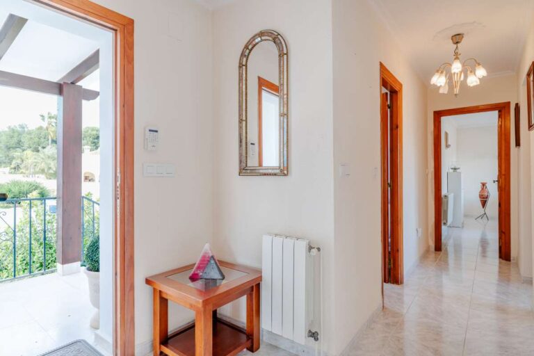 Interior hallway with terrace access and traditional details inside a Mediterranean villa in Calpe.