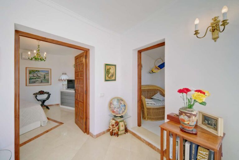 Interior hallway with traditional details and bright rooms inside a second line Mediterranean villa in Calpe.