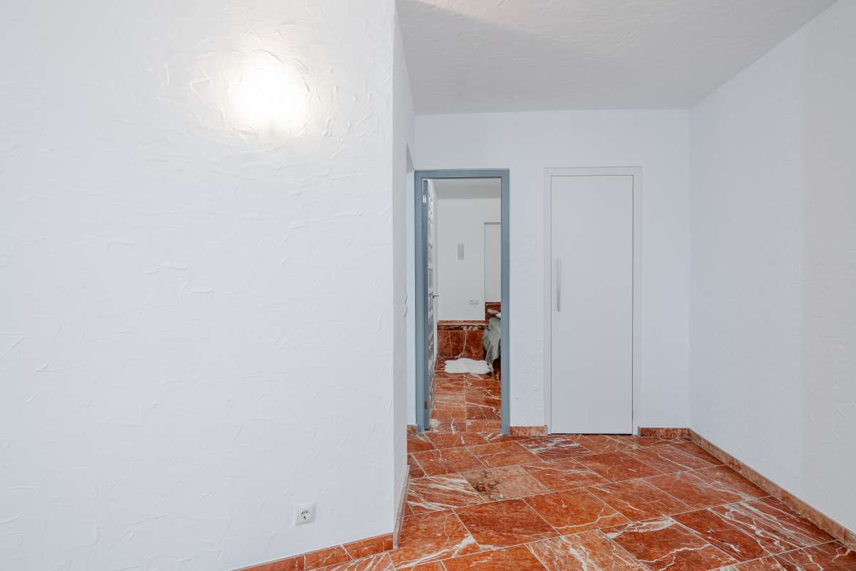 Interior room with terracotta flooring inside a Mediterranean villa in Maryvilla, Calpe.