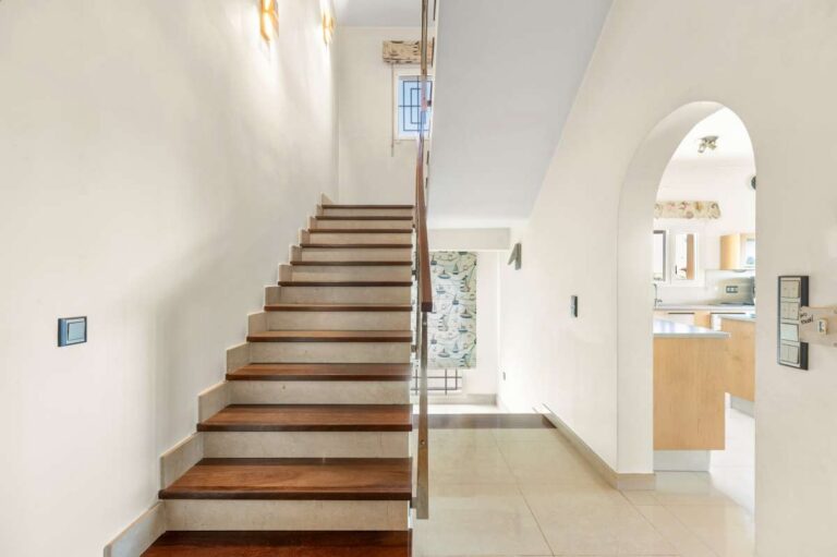Interior staircase inside a private villa in Calpe with access between the main living level and upper floor
